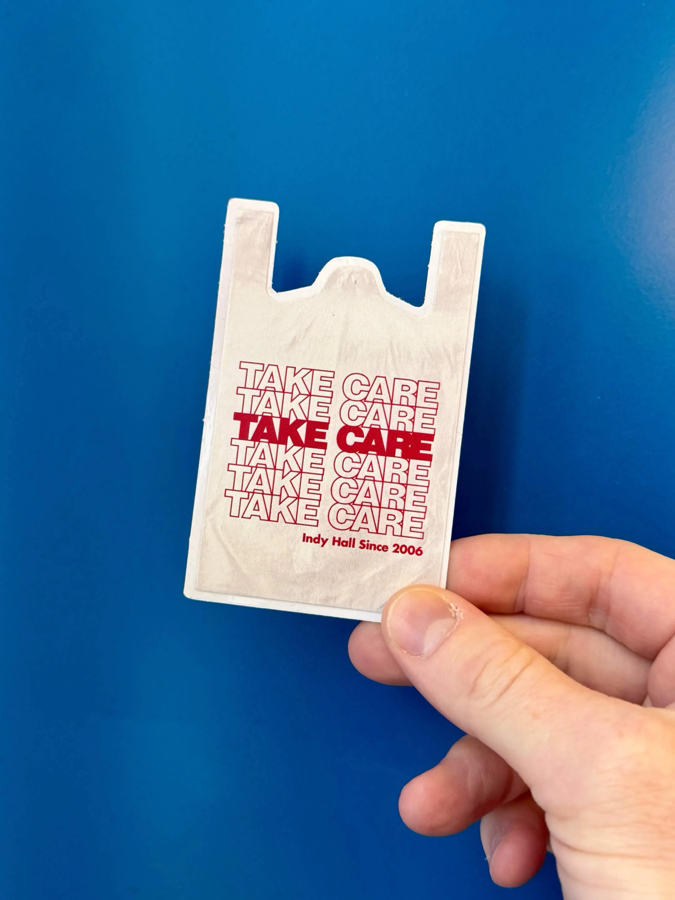 Take Care Sticker on tote bag